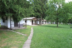 Cabins along a concrete slab path