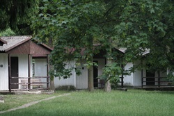 Row of cabins on a grassy area