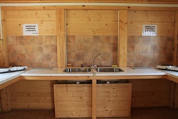 Shared kitchen with a sink and cookers
